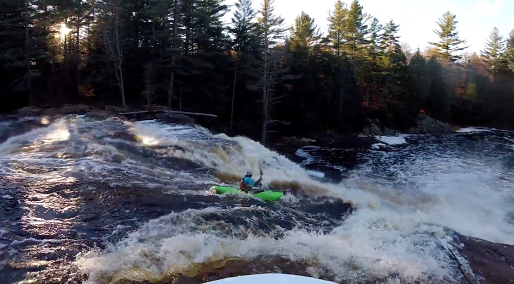 Canadian paddler Kai malcolm running a slide drop in Canada