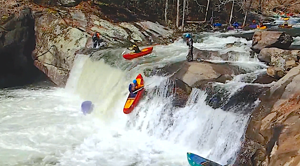 Fun chain beater featuring a bunch of open canoes at baby falls on the Tellico River in Tennessee (Usa) during the Aint Louie Fest (ALF)